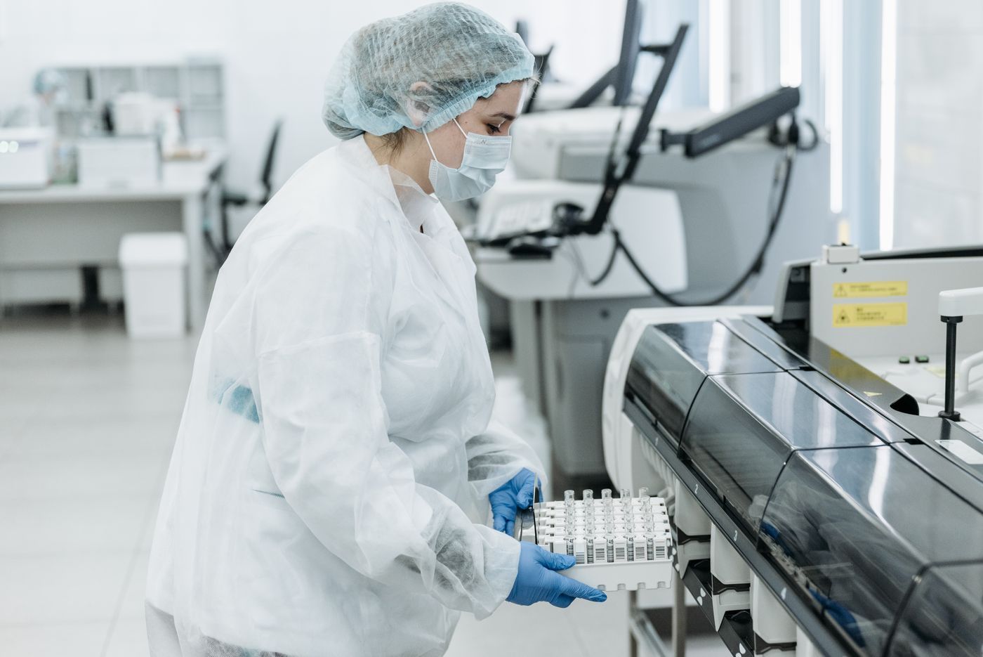 Laboratory scientist using a microscope